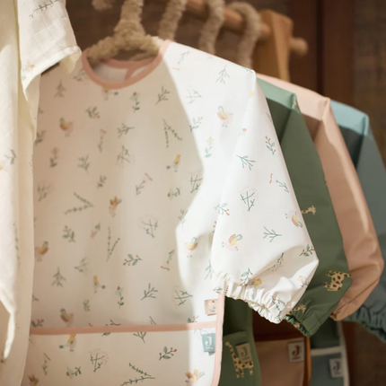 bavoir a manches fleurs