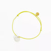Bracelet croix jaune fluo