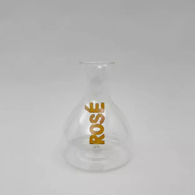 carafe en verre avec écriture rosé couleur ambre