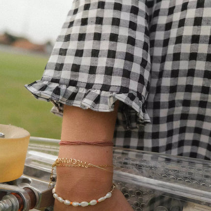Robe vichy noir et blanc avec froufrou au niveau des poignets NanyBlouses