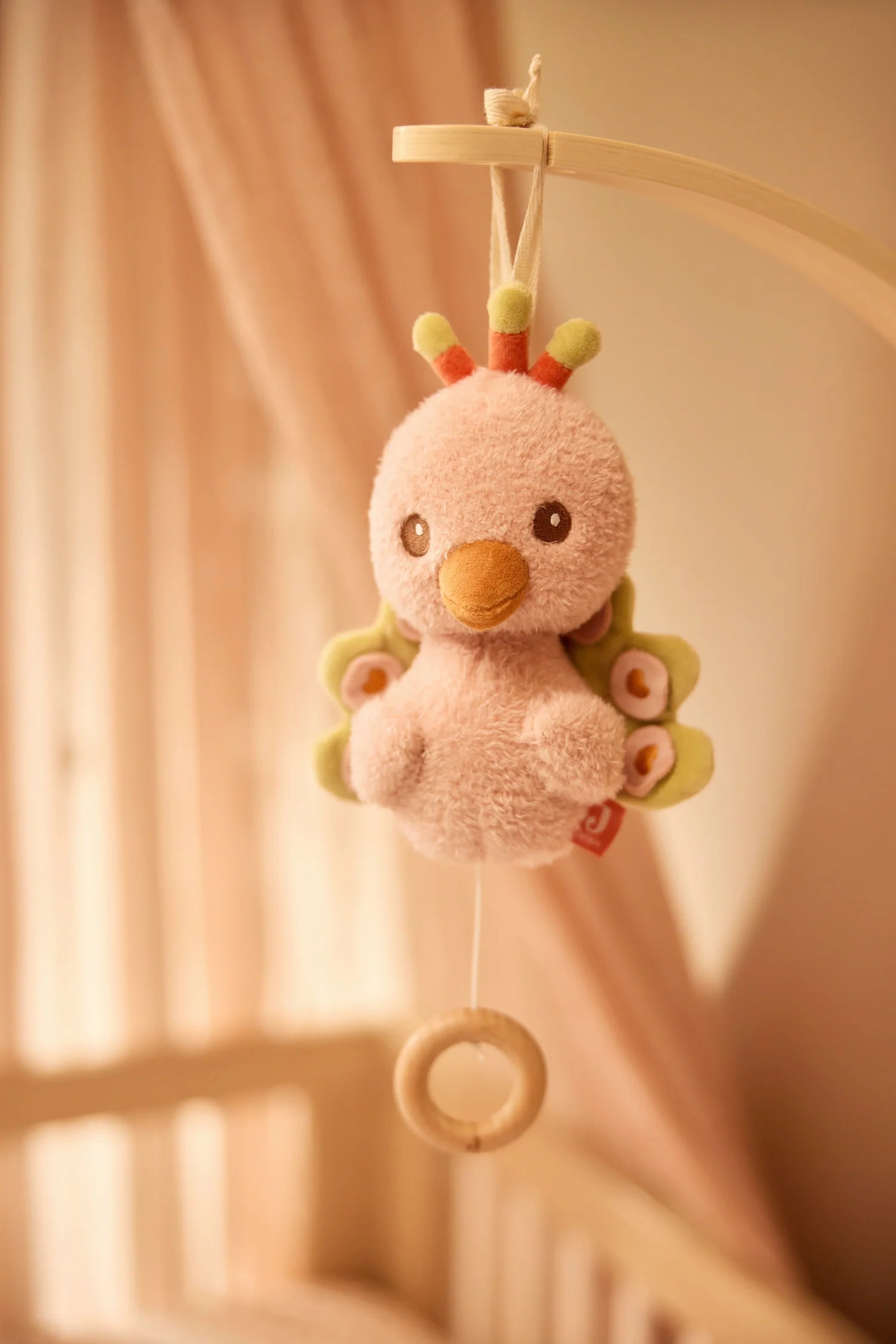 Peluche musicale Peacocke Jollein