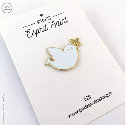 Pin's oiseau blanc et doré 